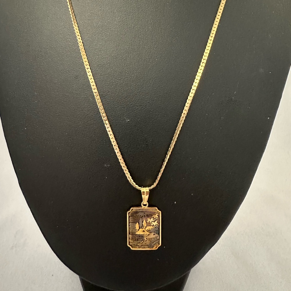 Amita damascene gold tone pendant necklace